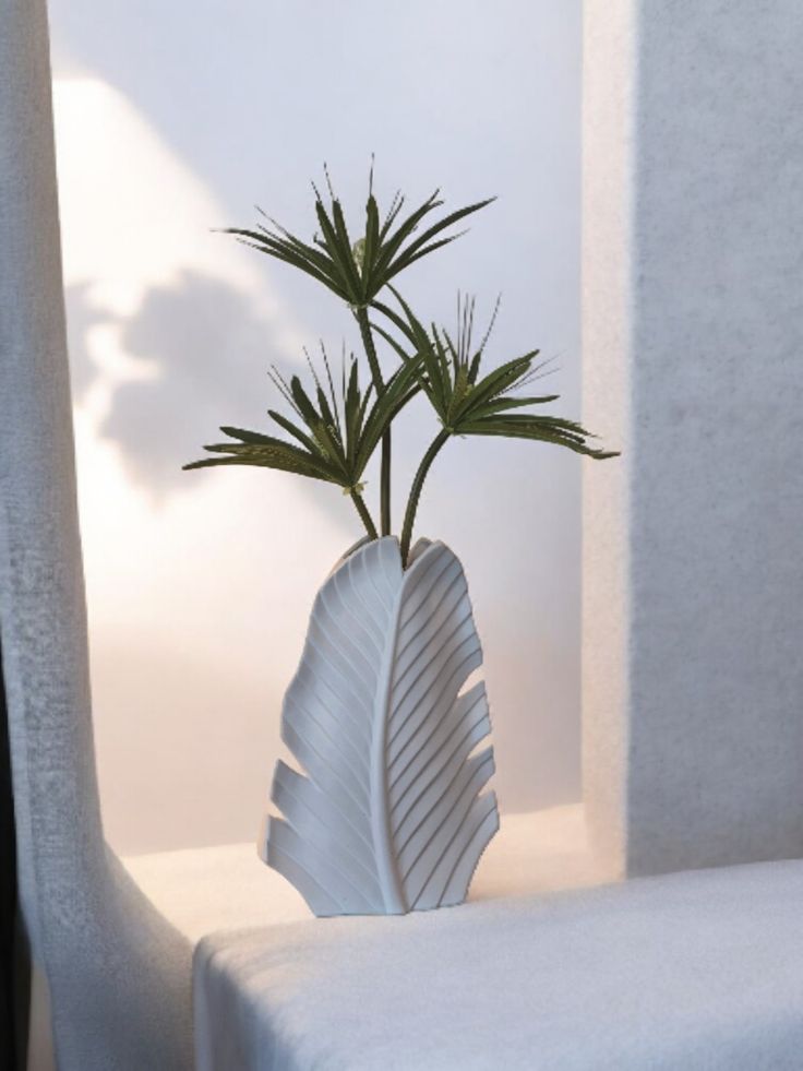 White leaflike ceramic vase with Fan Palm sprays