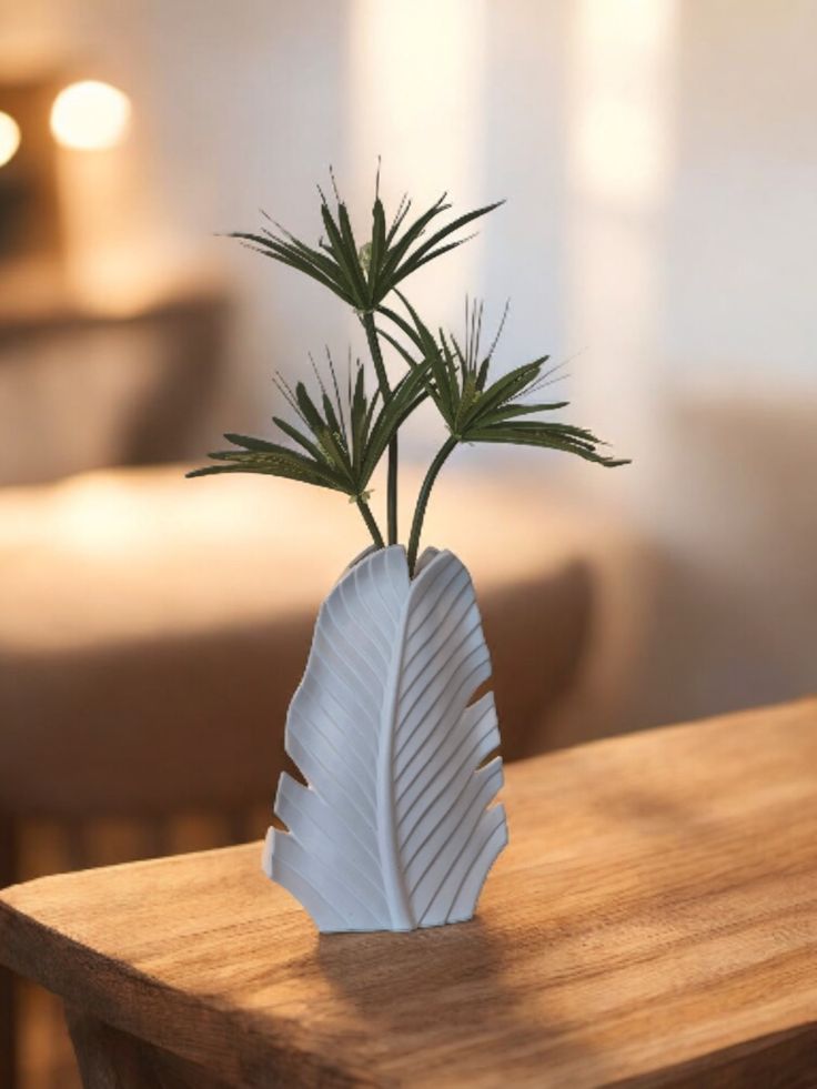 White leaflike ceramic vase with Fan Palm sprays